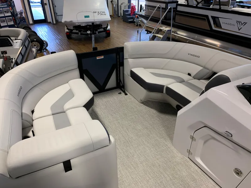 Slide: The Image of 2023 Viaggio Diamante 21U pontoon boat interior with white and gray seating. - 4