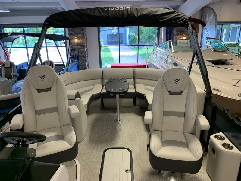 Slide: The Image of 2023 Viaggio Diamante 21U pontoon boat interior with plush seating and modern design. - 5