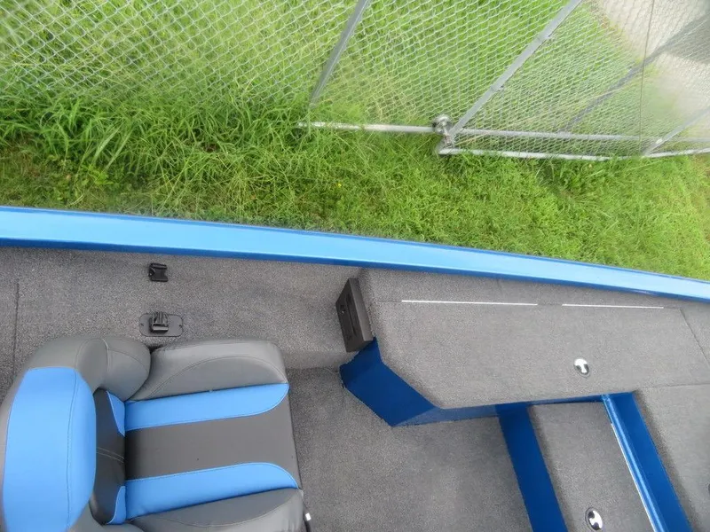 Slide: The Image of 2023 Vexus AVX 181 boat interior with blue and gray seating. - 11