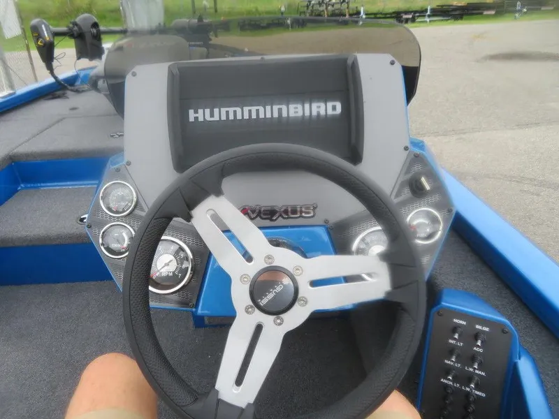 Slide: The Image of 2023 Vexus AVX 181 boat dashboard with Humminbird electronics and steering wheel. - 15
