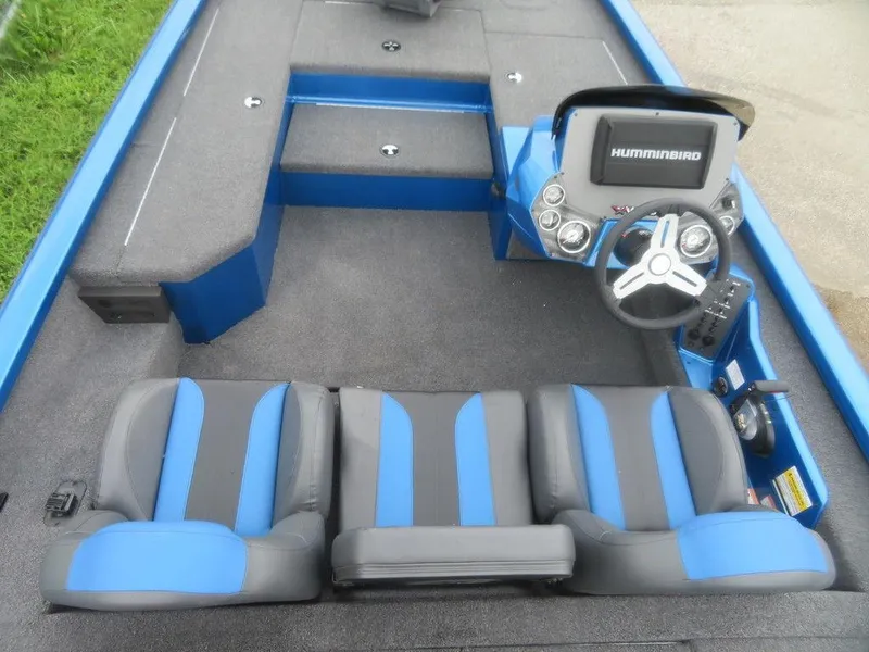 Slide: The Image of 2023 Vexus AVX 181 boat interior with blue and gray seats and Humminbird electronics. - 3
