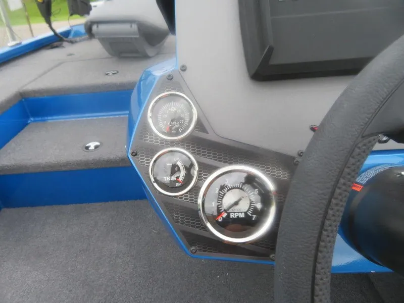 Slide: The Image of 2023 Vexus AVX 181 boat dashboard with gauges and steering wheel. - 7