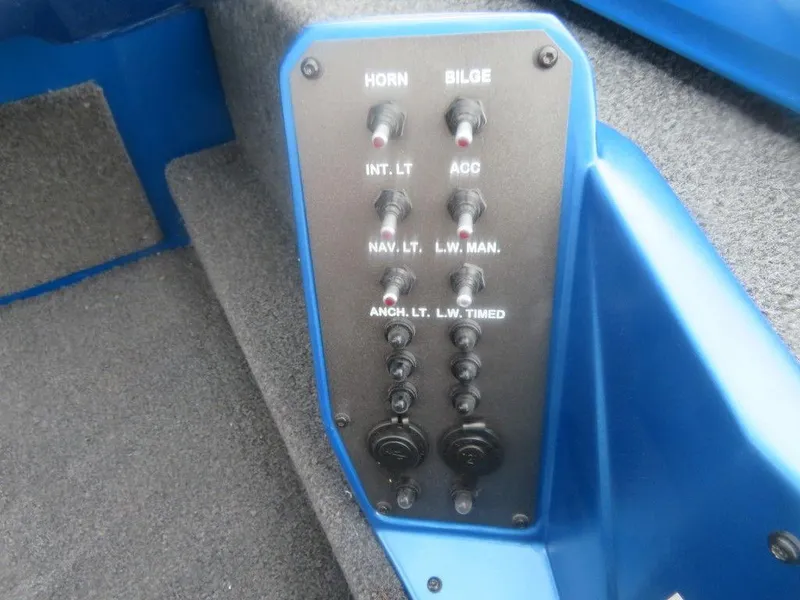 Slide: The Image of Control panel of a 2023 Vexus AVX 181 boat with various switches. - 8