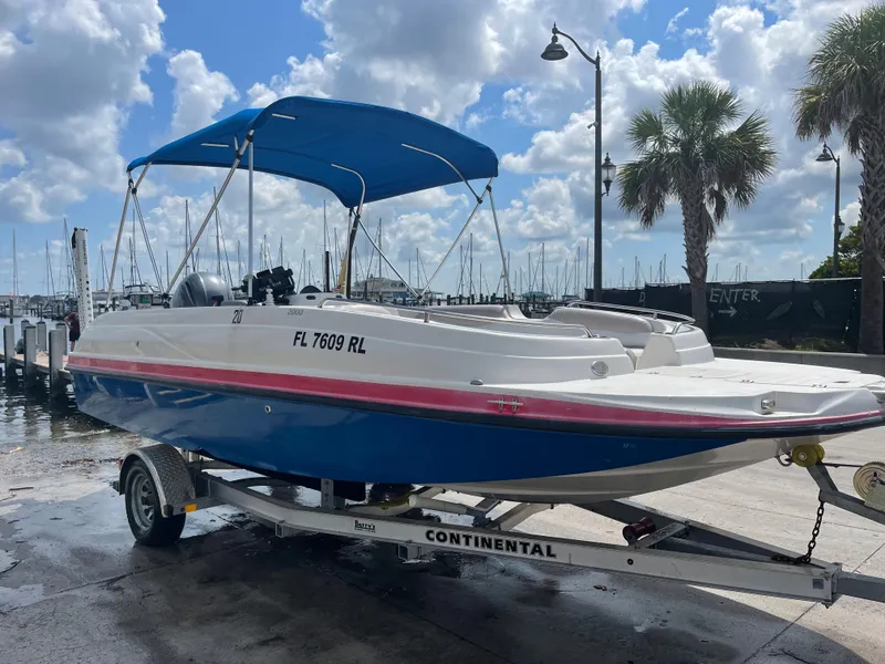 Slide: The Image of 2018 Starcraft 2000 OB Limited boat on Continental trailer at marina. - 0