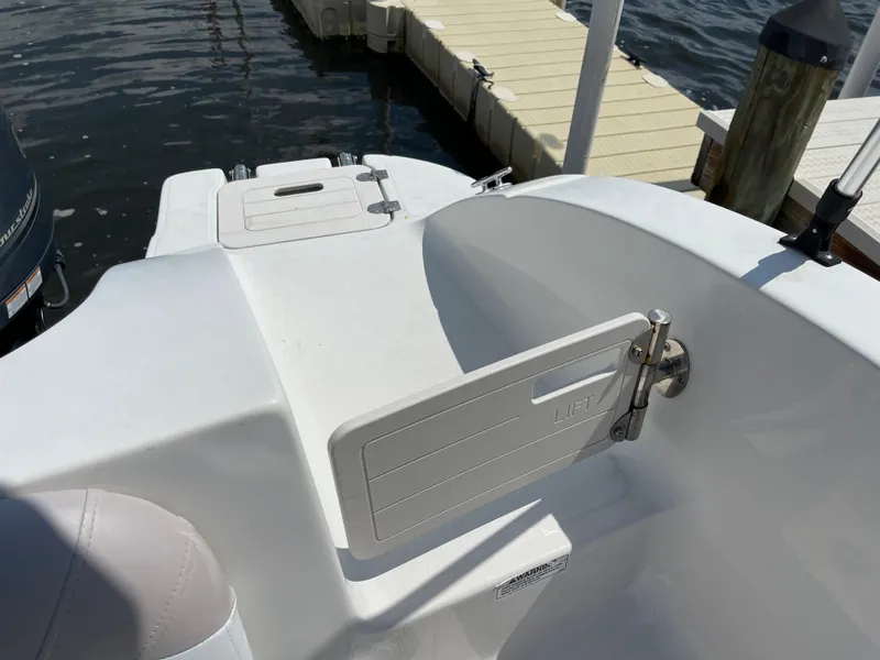 Slide: The Image of 2018 Starcraft 2000 OB Limited boat interior near dock. - 12
