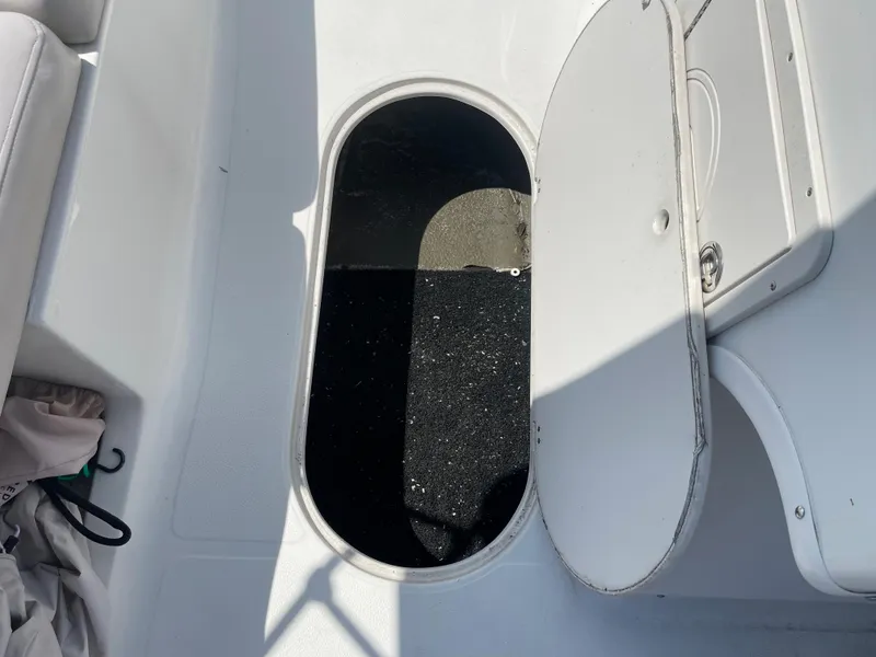 Slide: The Image of Open storage compartment on a 2018 Starcraft 2000 OB Limited boat. - 18
