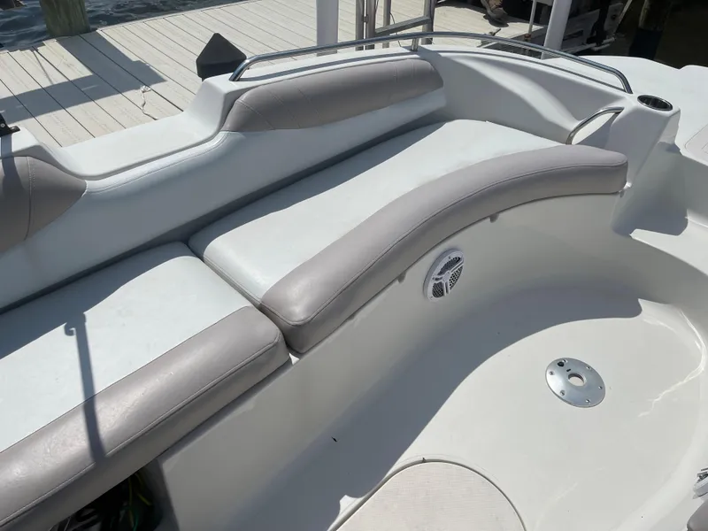 Slide: The Image of 2018 Starcraft 2000 OB Limited boat interior with cushioned seating and speaker. - 19
