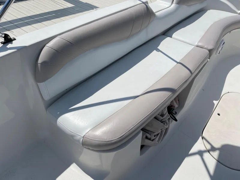 Slide: The Image of 2018 Starcraft 2000 OB Limited boat with gray and white cushioned seating. - 20