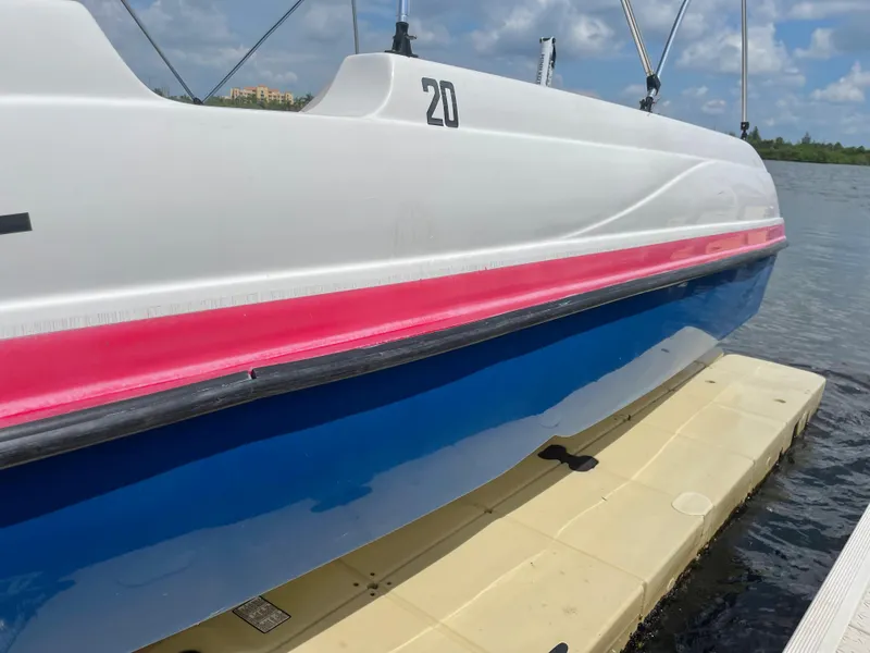 Slide: The Image of 2018 Starcraft 2000 OB Limited boat docked on a sunny day. - 4