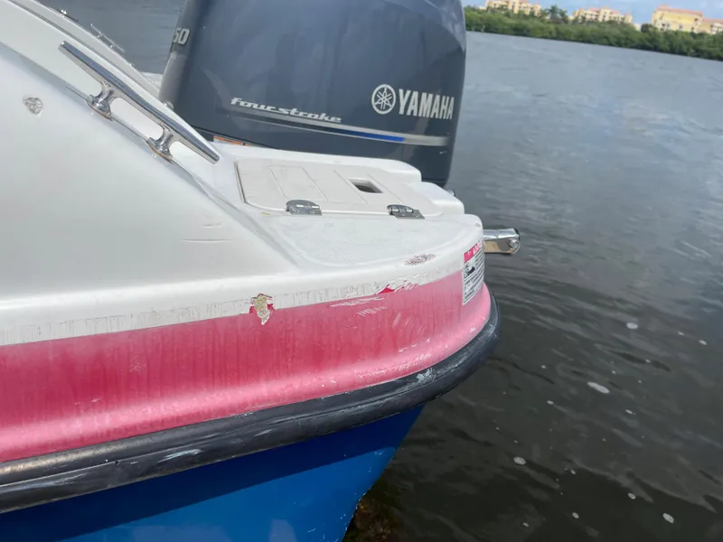 Slide: The Image of 2018 Starcraft 2000 OB Limited boat with Yamaha outboard motor on water. - 6