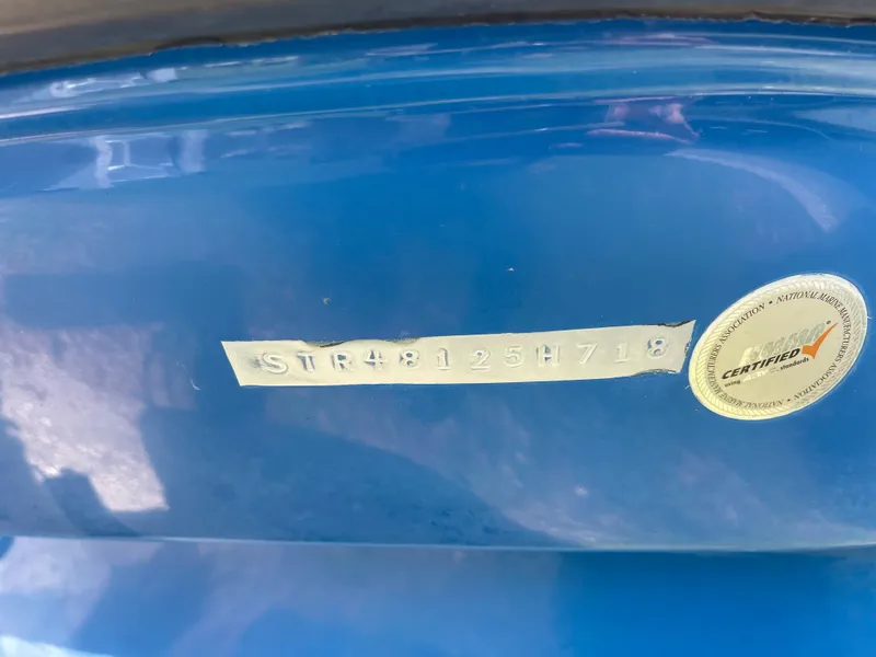 Slide: The Image of 2018 Starcraft 2000 OB Limited boat hull identification number (HIN) and certification sticker. - 7
