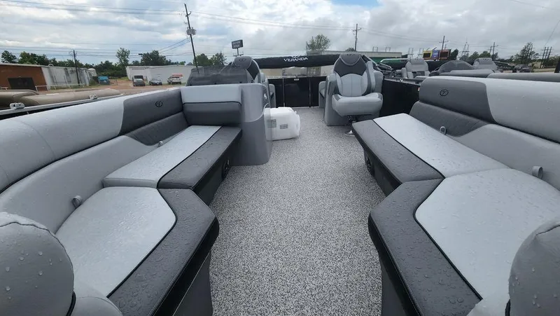 Slide: The Image of 2023 Veranda VISTA22RC Bi-Toon pontoon boat with sleek black design on display outdoors. - 3
