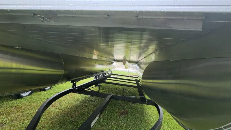 Slide: The Image of 2023 Veranda VISTA22RC Bi-Toon boat interior with gray seating and carpeted floor. - 6