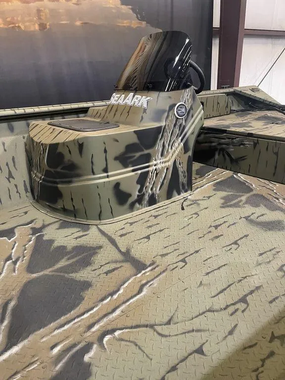 Slide: The Image of 2023 SeaArk RiverCat 200 Side Console boat with camouflage design. - 3