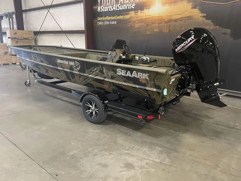 Slide: The Image of 2023 SeaArk RiverCat 200 Side Console boat with Mercury outboard motor in showroom. - 4