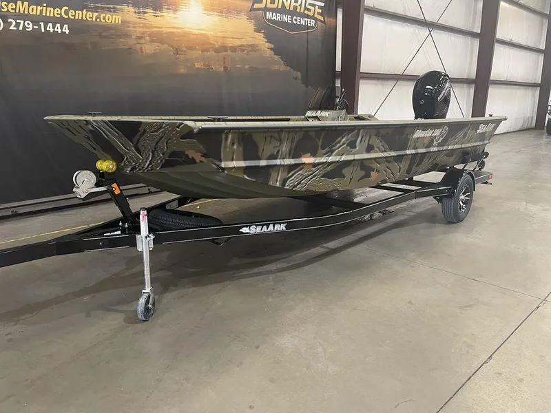 Slide: The Image of 2023 SeaArk RiverCat 200 Side Console boat in a showroom. - 8