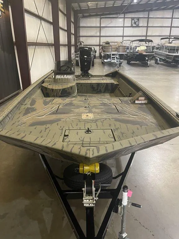 Slide: The Image of 2023 SeaArk RiverCat 200 Side Console boat in showroom. - 9