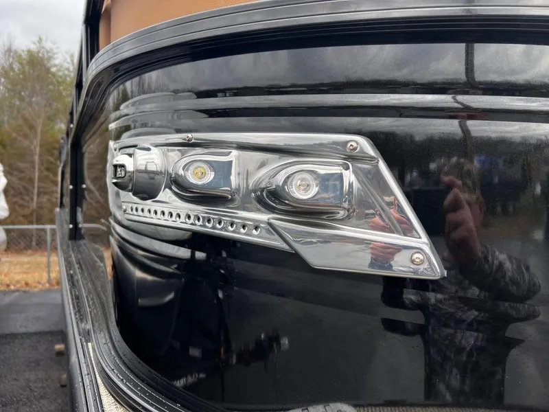 Slide: The Image of Close-up of 2023 Regency 250 LE3 boat's sleek LED headlight design. - 12
