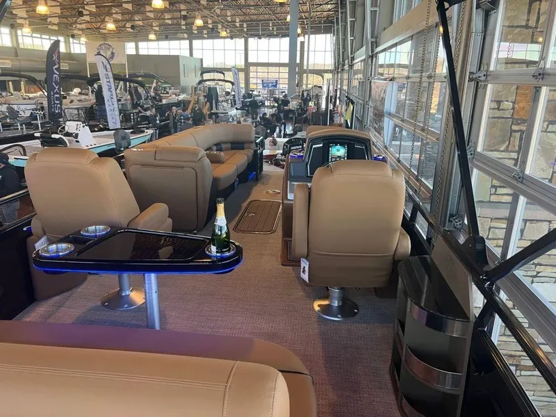 Slide: The Image of Luxurious 2023 Regency 250 LE3 pontoon boat interior with plush seating and modern amenities. - 3