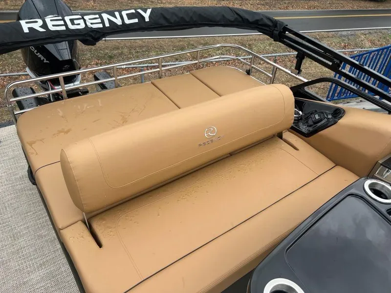 Slide: The Image of 2023 Regency 250 LE3 boat with tan seating and sleek design. - 8