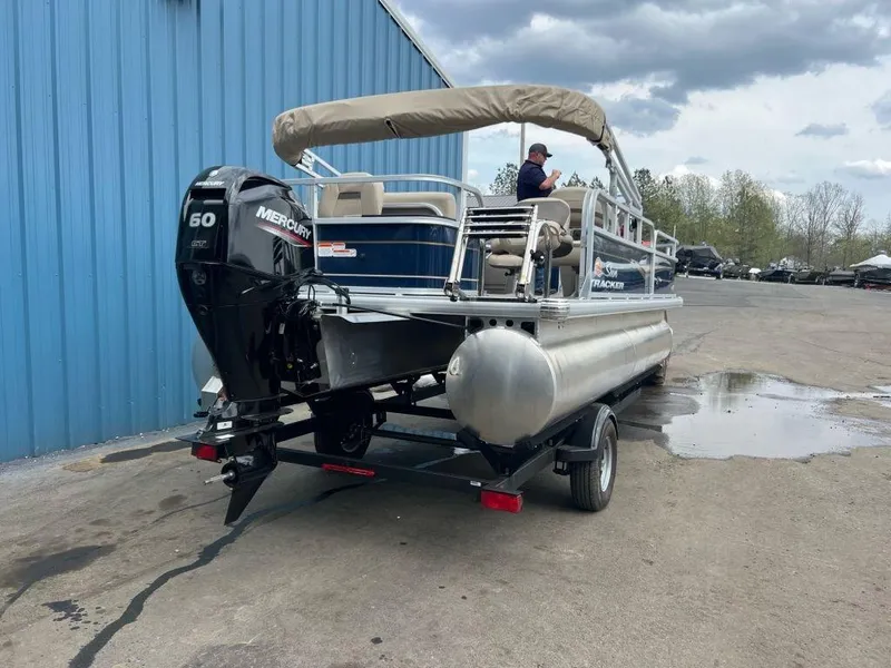 Slide: The Image of 2023 Sun Tracker BASS BUGGY® 18 DLX pontoon boat with Mercury 60 HP engine. - 2