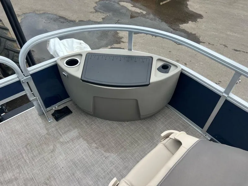 Slide: The Image of 2023 Sun Tracker BASS BUGGY® 18 DLX boat interior with fishing station and cup holders. - 8