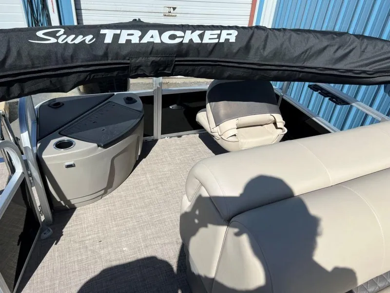 Slide: The Image of 2023 Sun Tracker Sportfish™ 20 DLX interior with seating and storage compartments. - 3