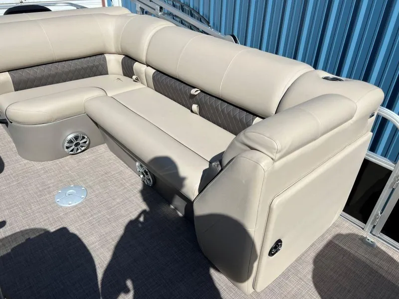 Slide: The Image of 2023 Sun Tracker Sportfish™ 20 DLX boat interior with beige cushioned seating. - 5