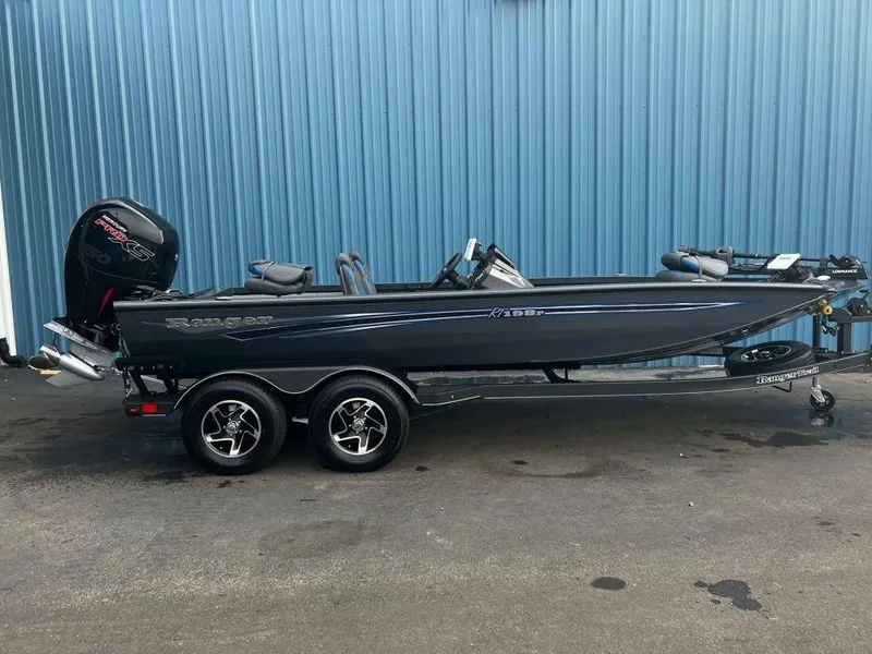 The Image of 2023 Ranger RT198P fishing boat on trailer, side view. - 0