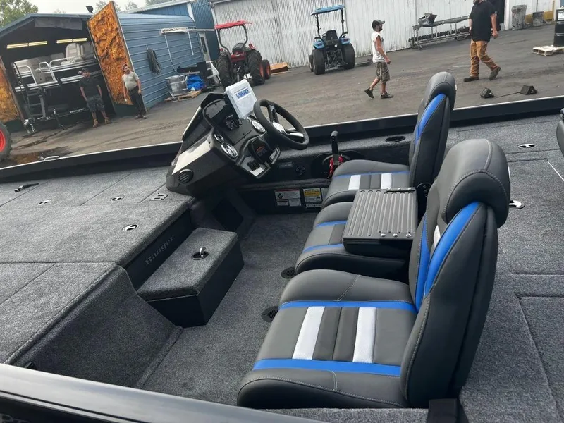 Slide: The Image of 2023 Ranger RT198P boat interior with seating and control console. - 3