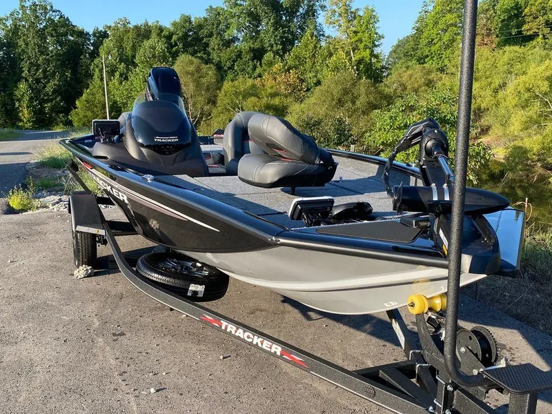 Slide: The Image of 2023 Tracker Pro Team 175 TF® fishing boat on trailer in outdoor setting. - 10