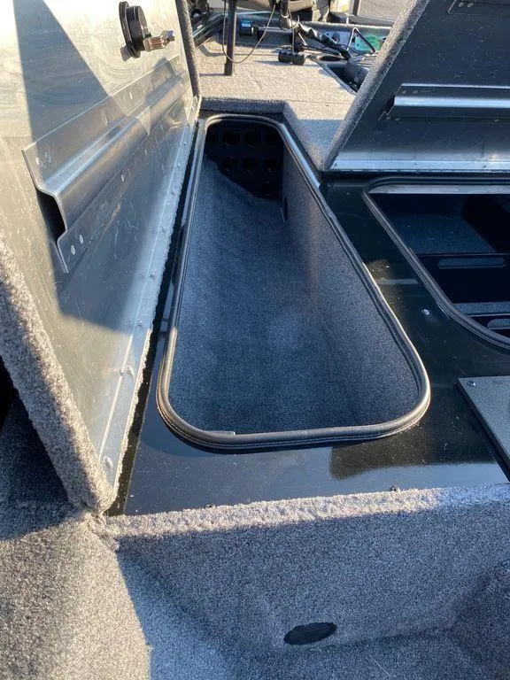 Slide: The Image of 2023 Tracker Pro Team 175 TF® boat storage compartment. - 2