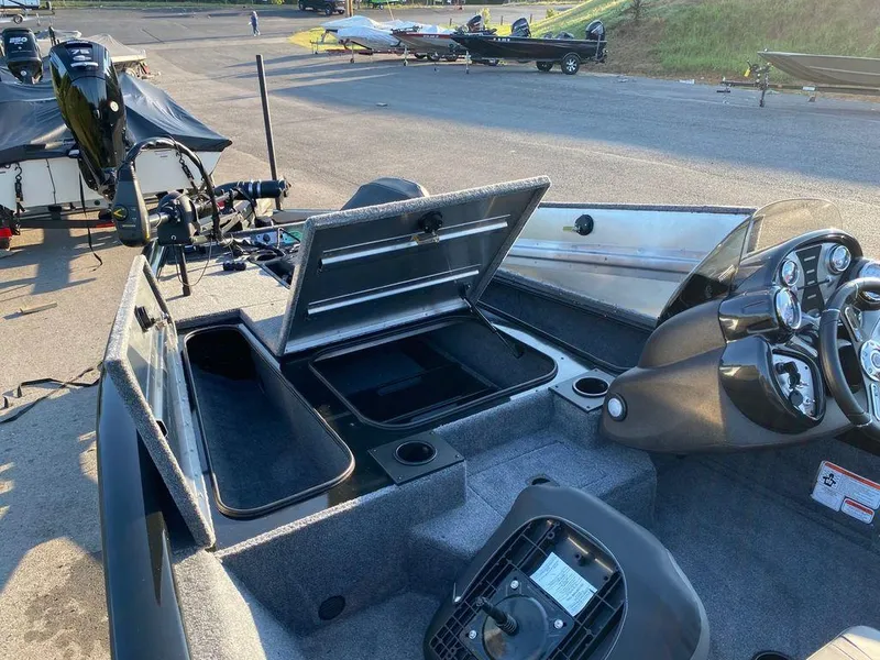 Slide: The Image of 2023 Tracker Pro Team 175 TF® boat interior with open storage compartments. - 3