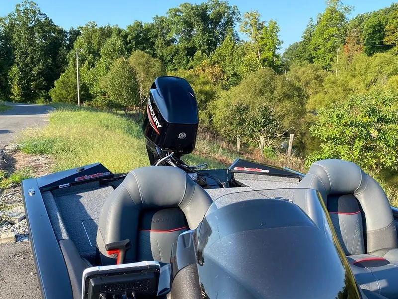 Slide: The Image of 2023 Tracker Pro Team 175 TF® boat with Mercury outboard motor in a scenic outdoor setting. - 6