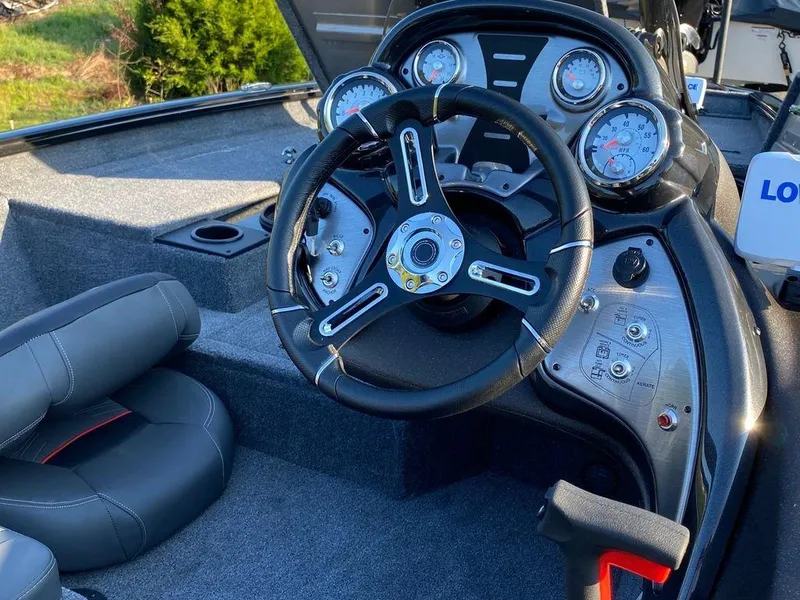 Slide: The Image of 2023 Tracker Pro Team 175 TF® boat dashboard and steering wheel. - 7