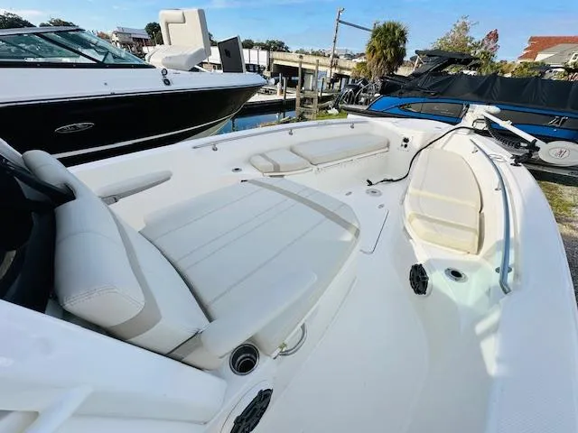 Slide: The Image of 2023 Boston Whaler 280 Dauntless boat interior with white seating and spacious deck. - 20