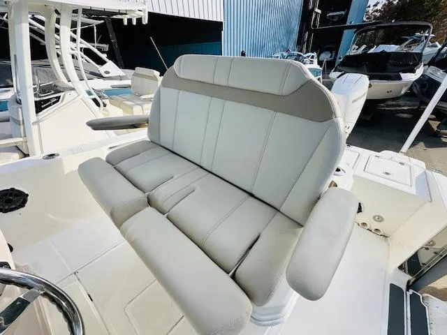 Slide: The Image of 2023 Boston Whaler 280 Dauntless boat seat, featuring plush, light gray upholstery. - 22