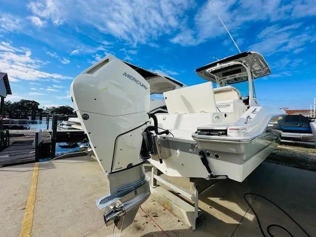 Slide: The Image of 2023 Boston Whaler 280 Dauntless boat with Mercury engine at dockside. - 5
