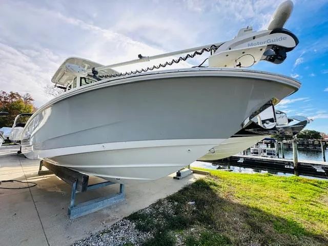 Slide: The Image of 2023 Boston Whaler 280 Dauntless boat on display at a marina. - 8