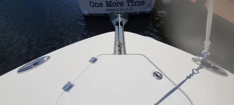 Slide: The Image of Bow of 2015 Robalo R300 Center Console boat with anchor and hatch. - 15