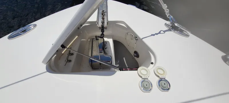 Slide: The Image of 2015 Robalo R300 Center Console anchor locker with open hatch. - 16