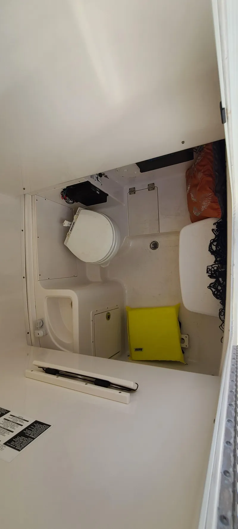 Slide: The Image of 2015 Robalo R300 Center Console boat interior bathroom with toilet and storage. - 25