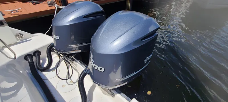 Slide: The Image of 2015 Robalo R300 Center Console with twin Yamaha outboard engines. - 34