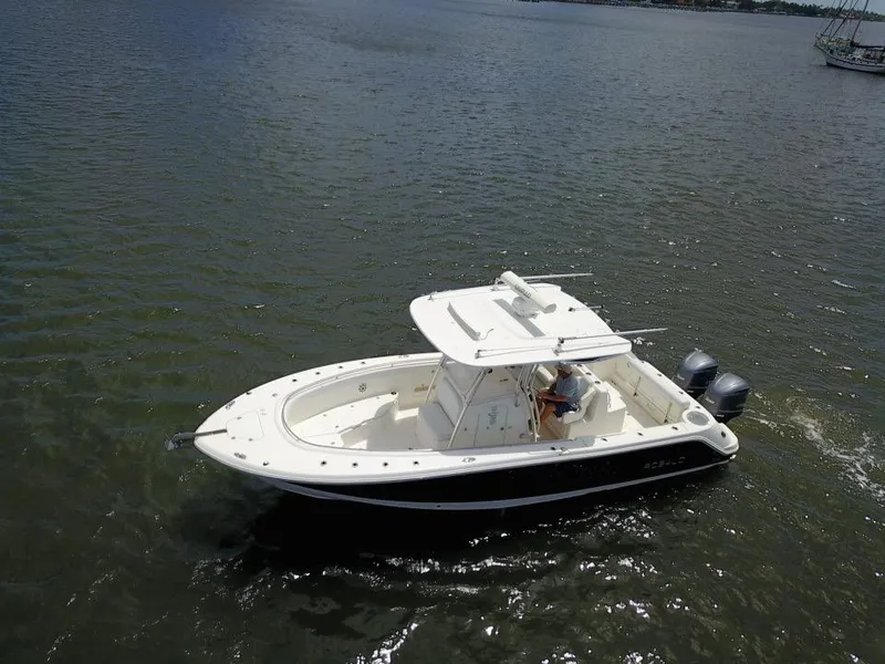 Slide: The Image of 2015 Robalo R300 Center Console boat on open water. - 39