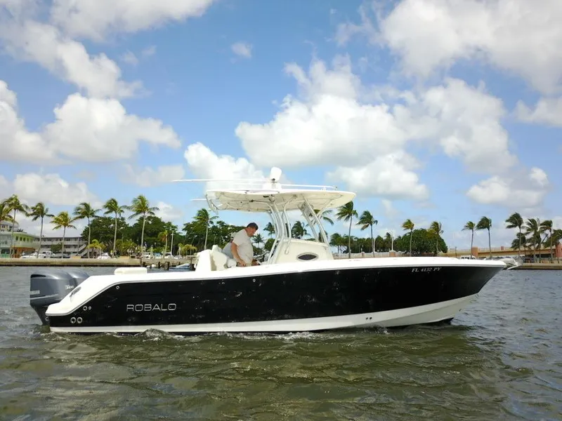 Slide: The Image of 2015 Robalo R300 Center Console boat cruising on a sunny day. - 43