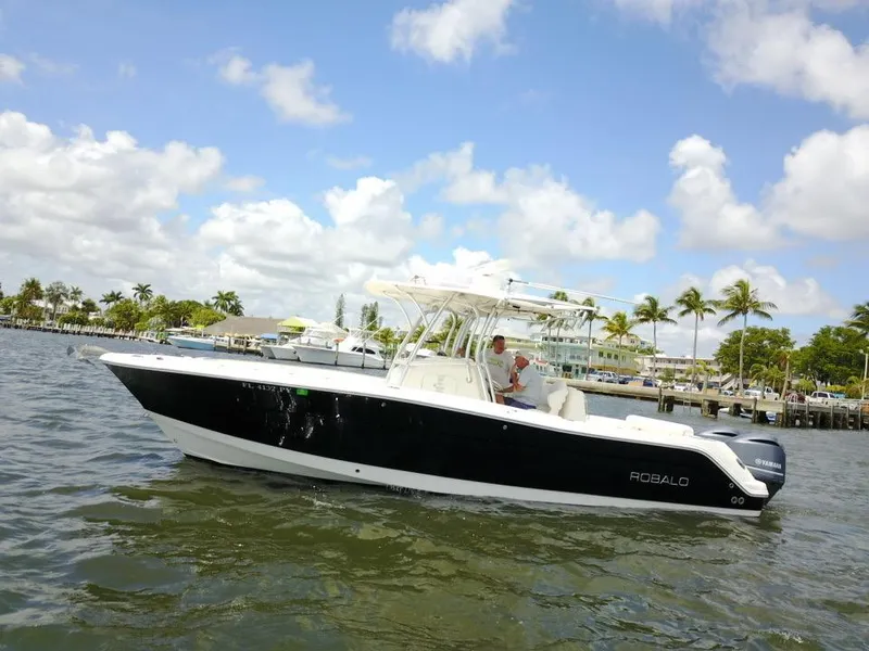 Slide: The Image of 2015 Robalo R300 Center Console boat cruising on a sunny day. - 46