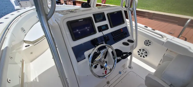 Slide: The Image of 2015 Robalo R300 Center Console boat helm with advanced navigation systems. - 9