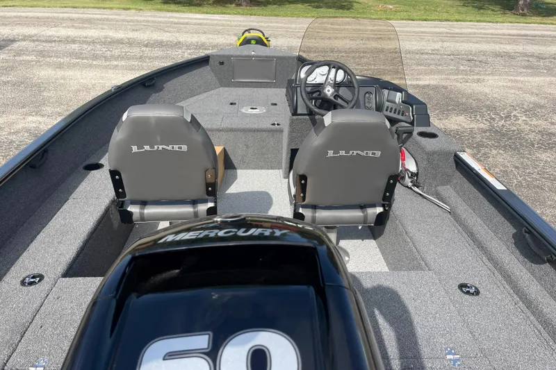 Slide: The Image of 2025 Lund 1650 Rebel XL SS boat interior with Mercury 60 engine. - 3