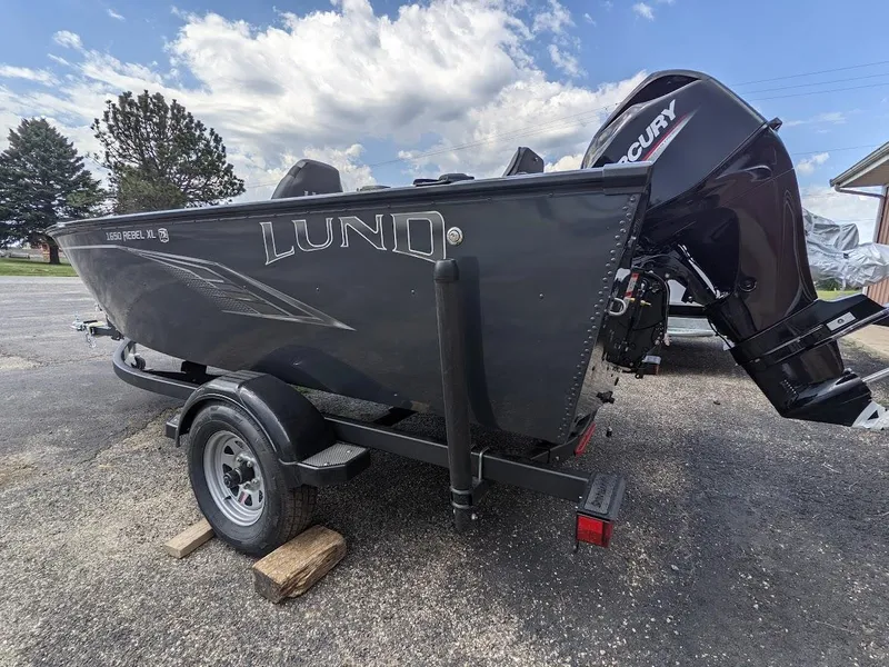Slide: The Image of 2025 Lund 1650 Rebel XL SS fishing boat on trailer with Mercury outboard motor. - 6