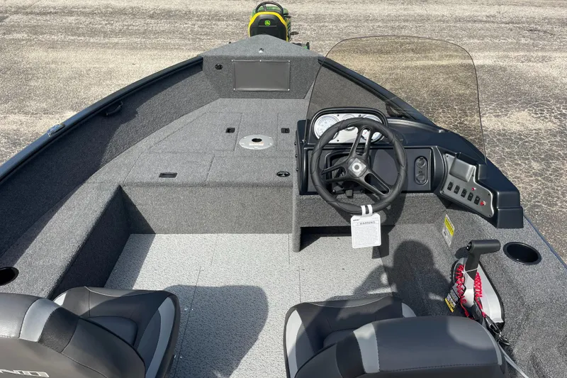 Slide: The Image of 2025 Lund 1650 Rebel XL SS boat interior with steering console and seating. - 7